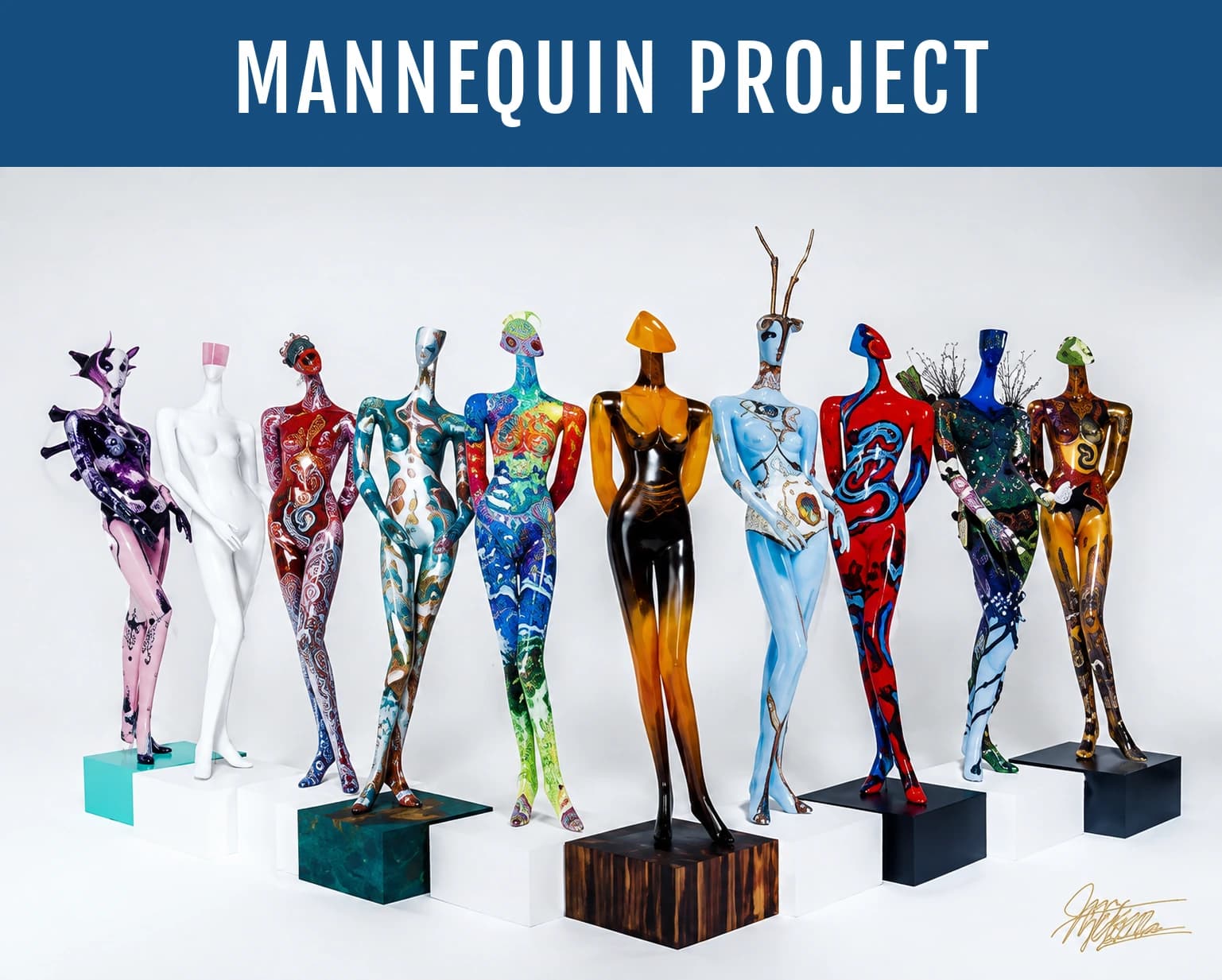 A row of full-size mannequins hand-painted by local artists, displayed on pedestals for the Mannequin Project