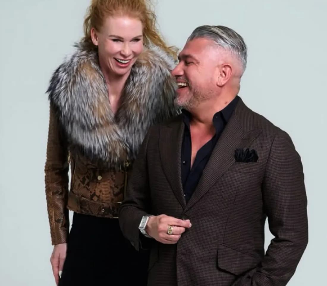 Two guests sharing a laugh at a Las Vegas Fashion Council event